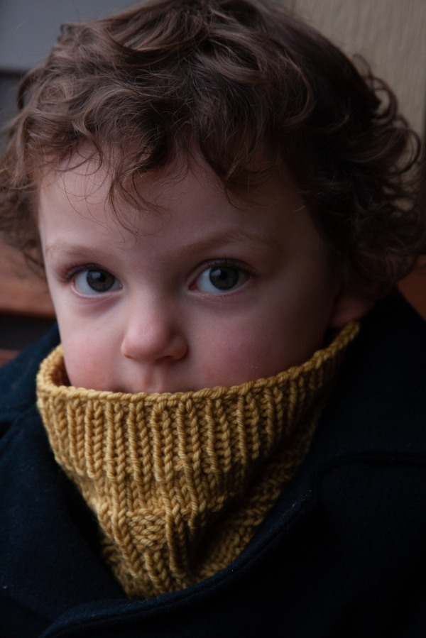 child in textured cowl